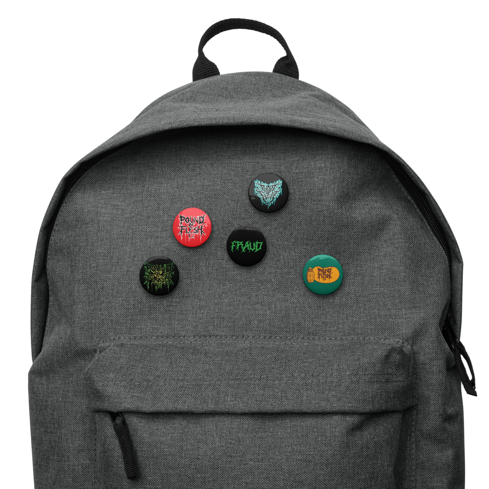 A set of 5 pinds on a backpack with the old logo, new Pound Of Flesh TX logo, Fraud, and Cracker Barrel Design on them.
